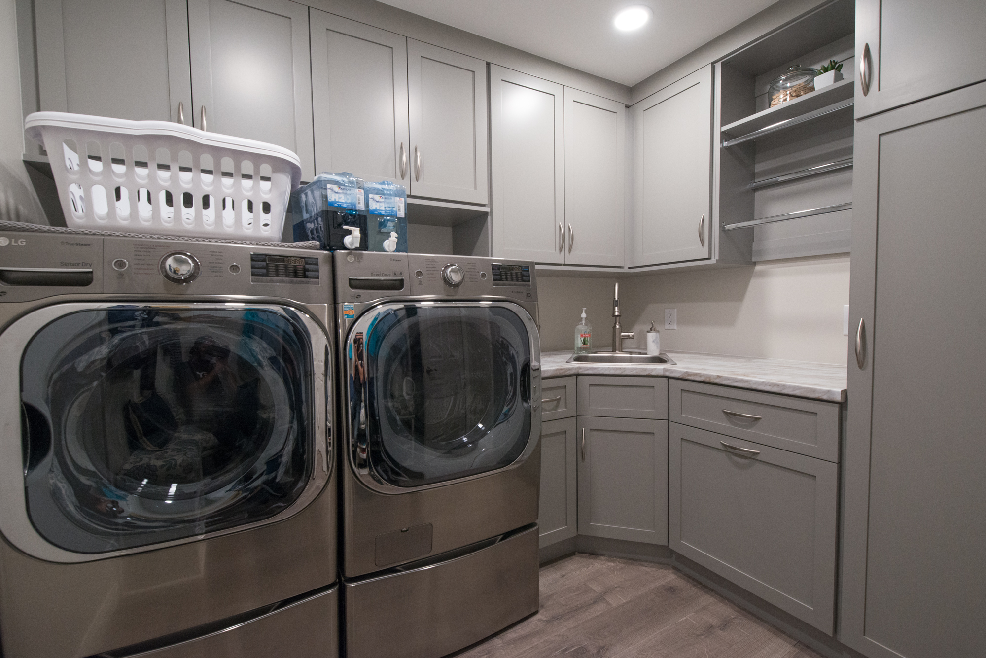 Modern laundry room with floating cabinets