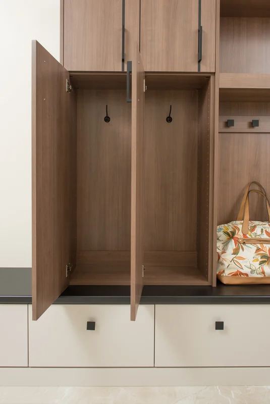 Modern walnut mudroom with locker-style cabinets