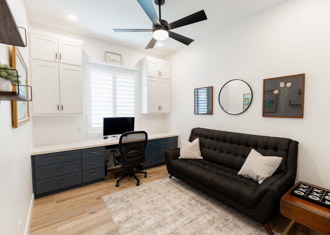 Custom home office with built-in desk and shelving