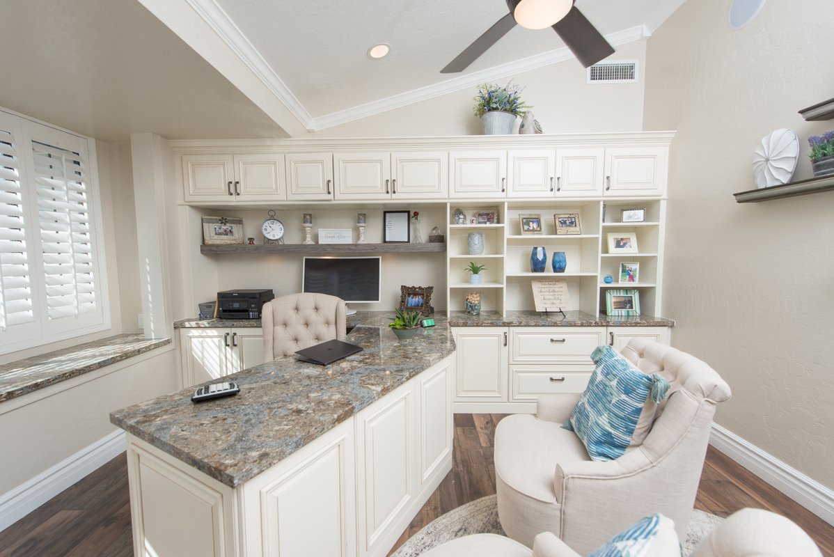 Executive home office with floor-to-ceiling bookcases