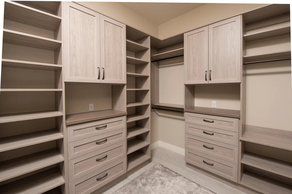Natural wood tone closet with custom shelving