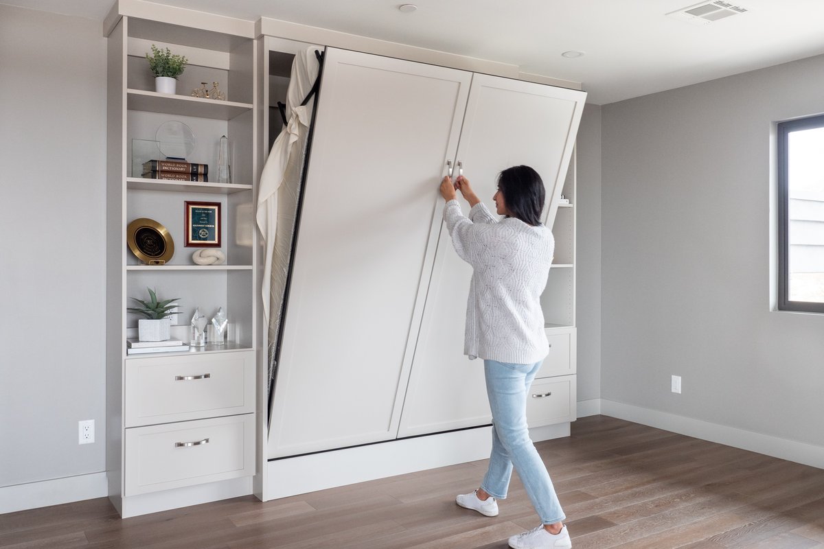 Demonstration of smooth wall bed operation with built-in shelving